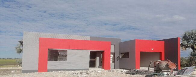 Housing units under construction at the Ekuku development